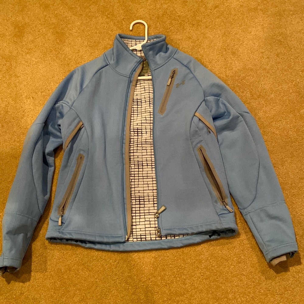Under Armour water resistant zip up jacket. Carolina blue with grey trim.